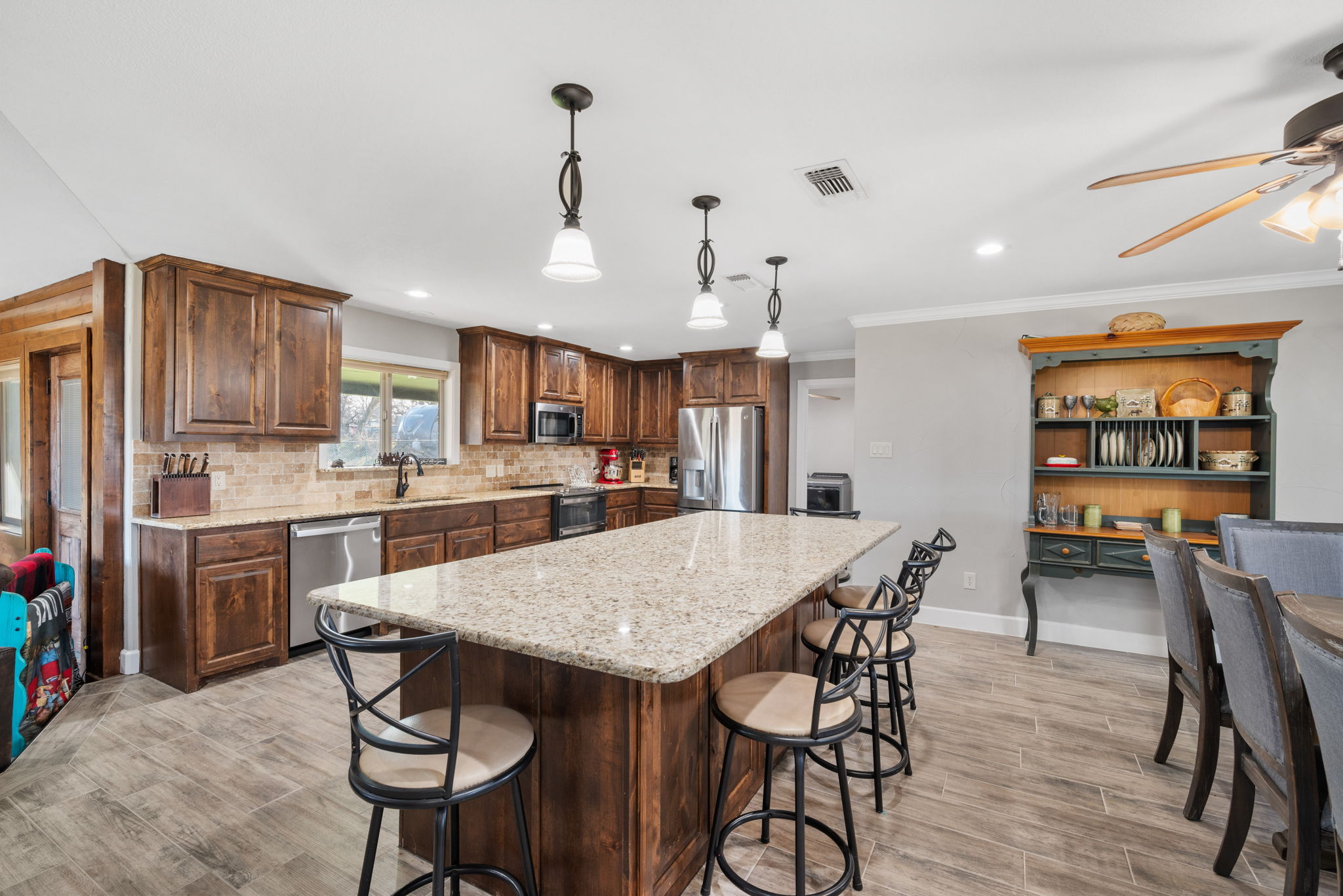 Kitchen with an Island and chairs